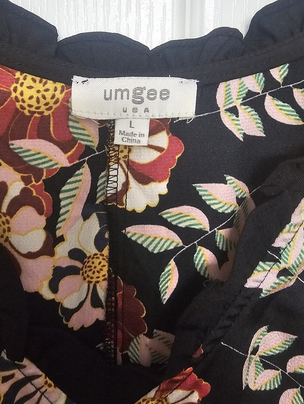 Umgee babydoll blouse features a bold, mixed design combining bohemian andanimal - Picture 3 of 10